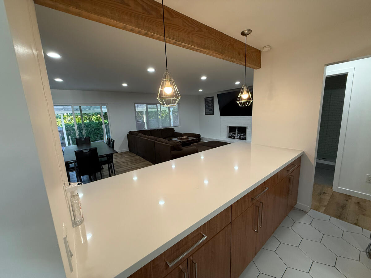 Inside kitchen, looking out towards dining and living room at Clean Quarters Inc. Foundation House.